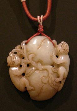 Celadon and Brownish-Jade Peach and Monkey Group Pendant on a Silk Double Cord - Closeup View