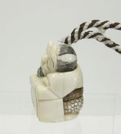 Japanese Ivory Netsuke of a Dozing Calligrapher - Mid 20th c. -Side View