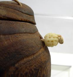 Antique Japanese Mingei (Folk Art) Mulberry Wood Tonkotsu (Tobacco Box) - Okame - Closeup of Carved Roundels