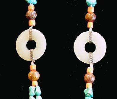 Turquoise, Coral and Agate Necklace with Carved Double Jade Prayer Wheel - Closeup View of Jade Bi